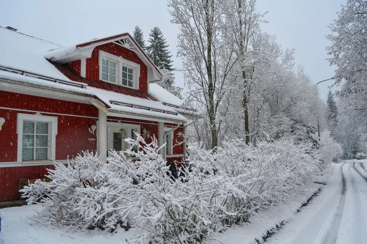 Snowy day in Finland. Roof covered with snow